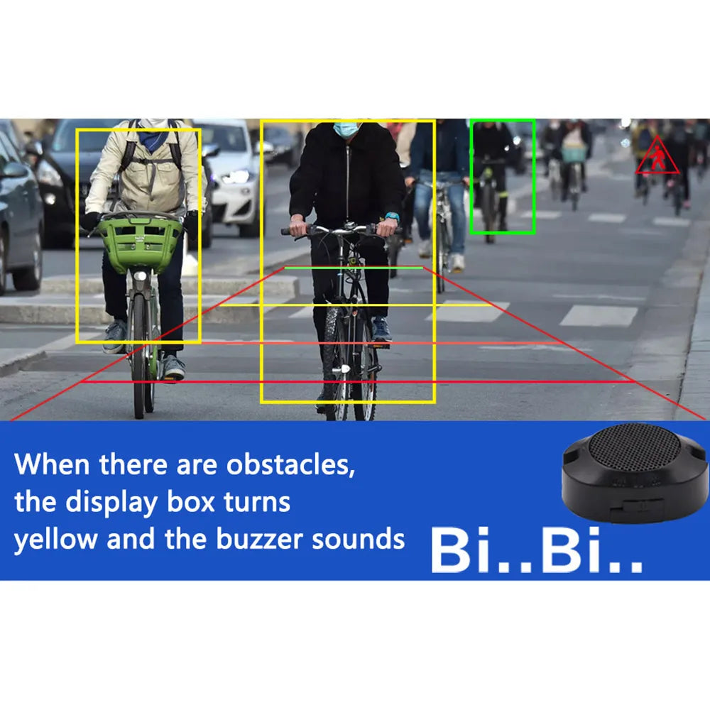 Reversing camera display showing cyclists highlighted in yellow boxes with distance markers and a small black buzzer.