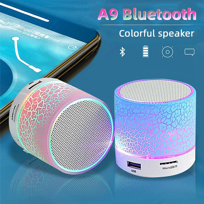 Two portable mini Bluetooth speakers with a glowing, multi-coloured crackle finish and USB/microSD card slots.