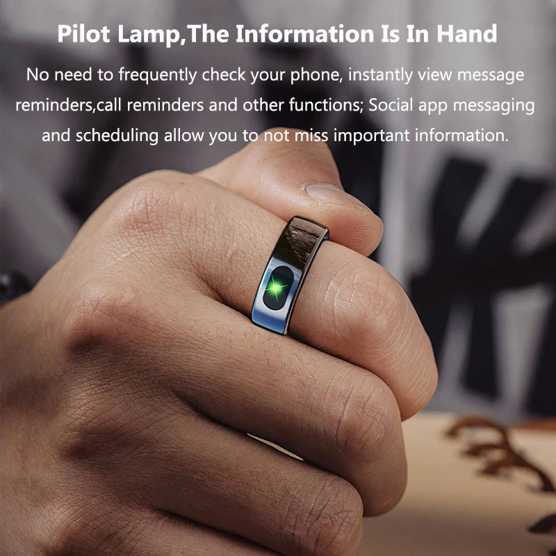 A sleek, metallic smart ring worn on a finger, featuring a small, glowing green light indicator for notifications.