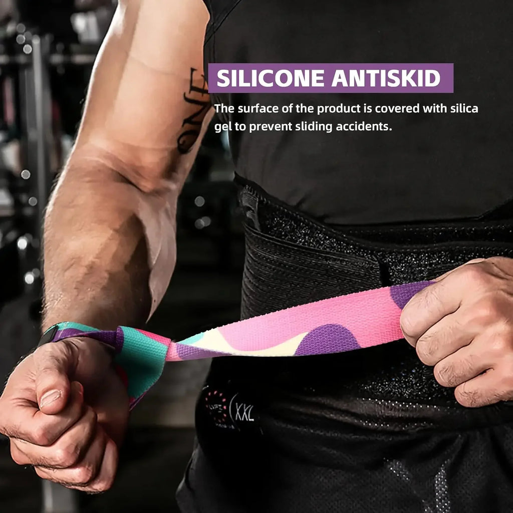A person wearing a black waist trainer and holding a colourful pink, purple, and teal silicone-grip lifting strap.
