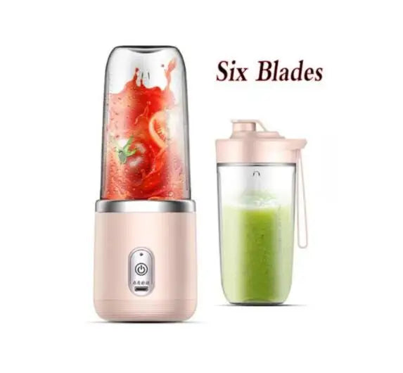 Portable pale pink blender with 6 blades, featuring a clear cup filled with fruit and a separate travel lid.