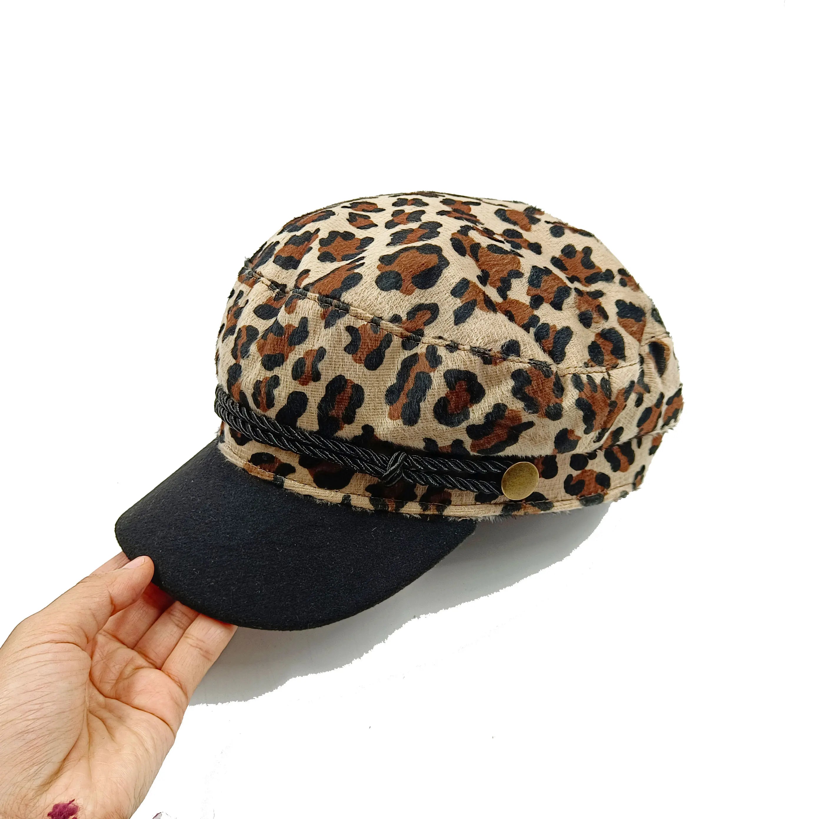 Leopard print newsboy cap with a black brim, decorative cord trim and gold-tone side button.
