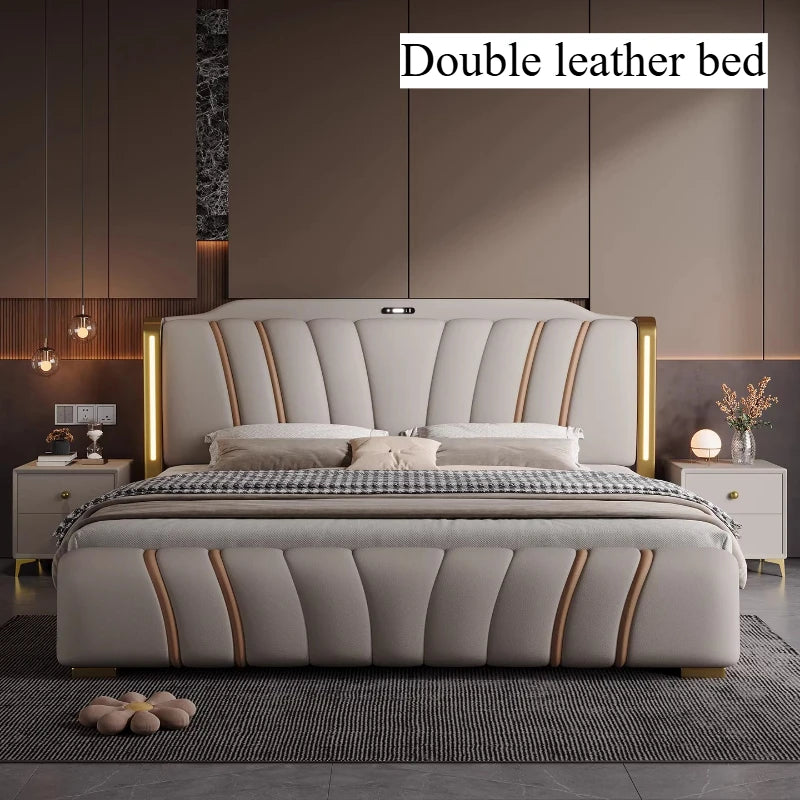 Luxury modern grey leather bed with curved panel design, integrated headboard lighting, and gold metallic accents.