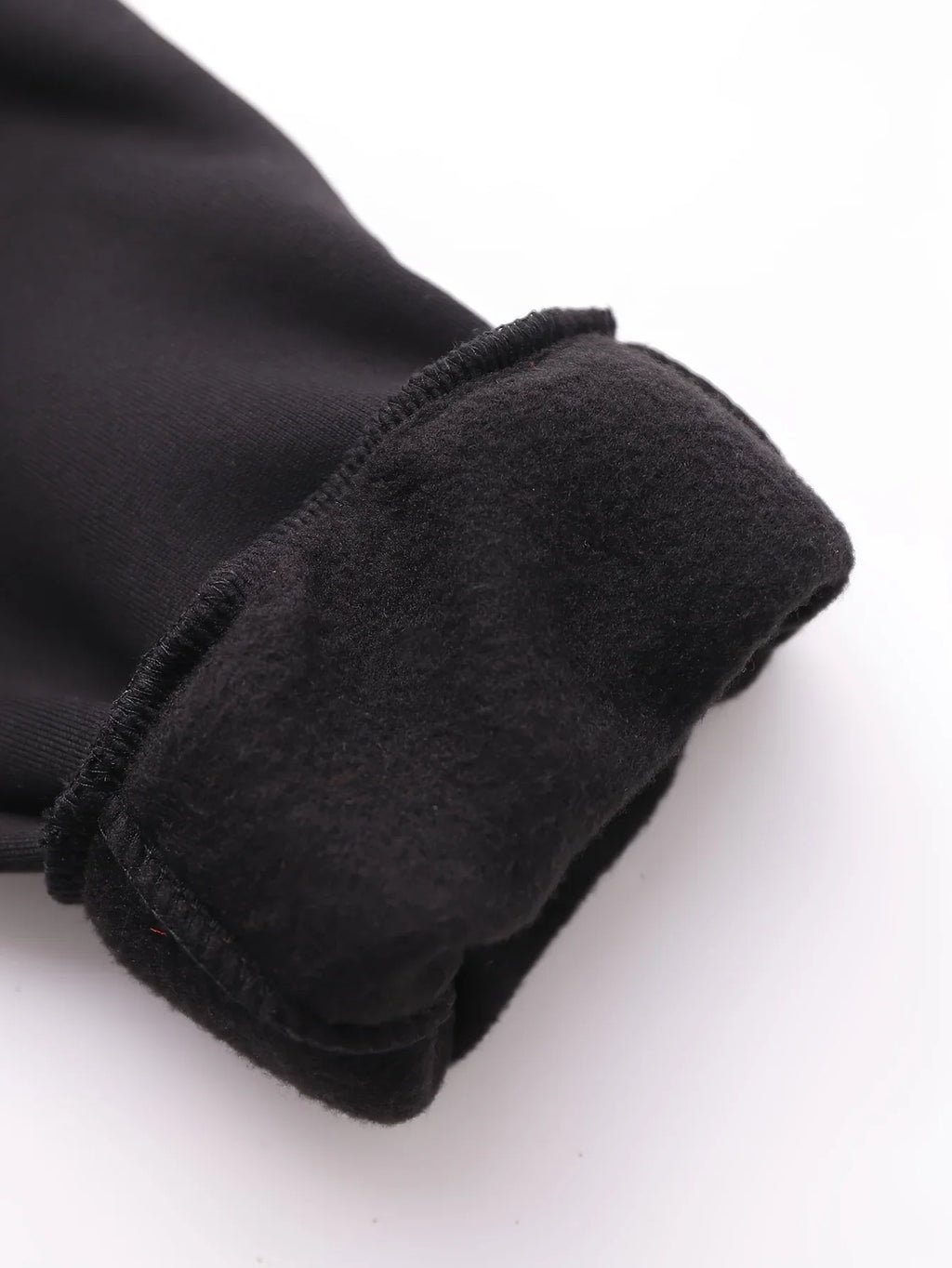 Close-up of a black garment sleeve with a warm, soft-touch fleece lining for added insulation.