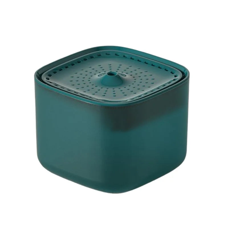 Square dark teal pet water fountain with a perforated top surface and central water spout.