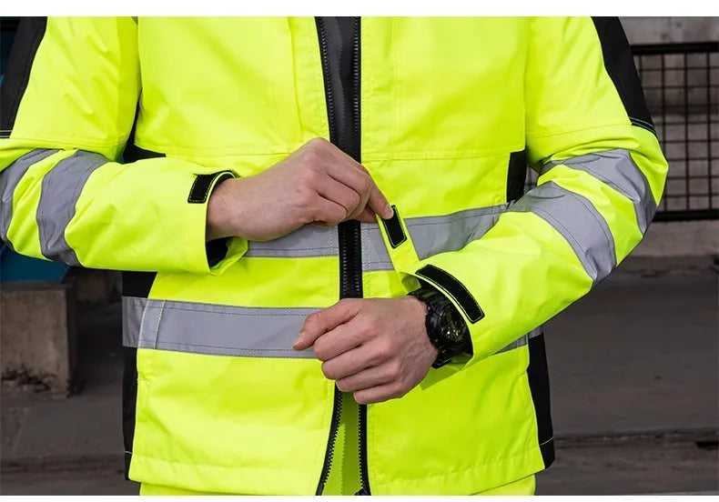 High-vis yellow waterproof jacket with black detailing, reflective bands, and a secure front zip fastening.