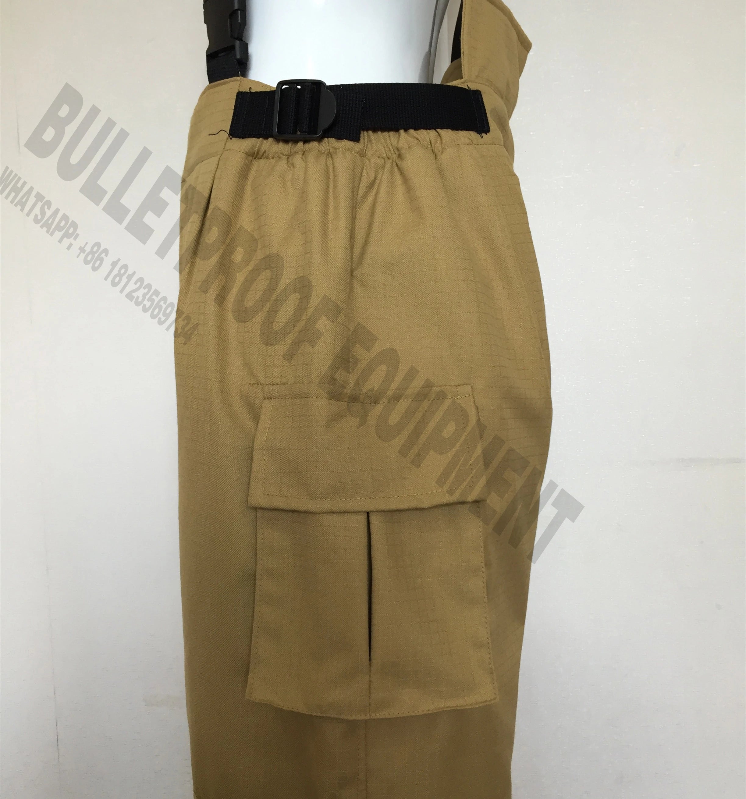 Tan cargo tactical pants with a grid-pattern fabric, black waist strap, and side cargo pocket on a white background.