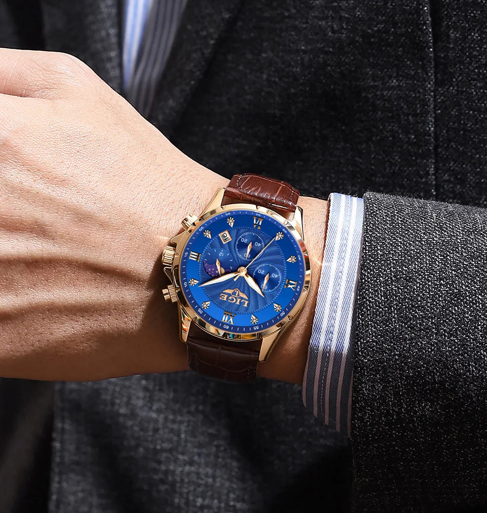 Men’s gold-tone chronograph watch with a blue dial, moon phase display, and a brown croc-effect leather strap.