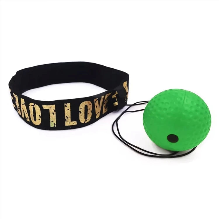 Boxing reflex training set with a dimpled green ball on an elastic string and a black headband with gold lettering.