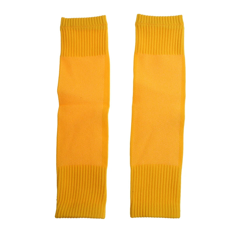 Pair of plain yellow football sock sleeves with ribbed cuffs for a secure, comfortable fit.