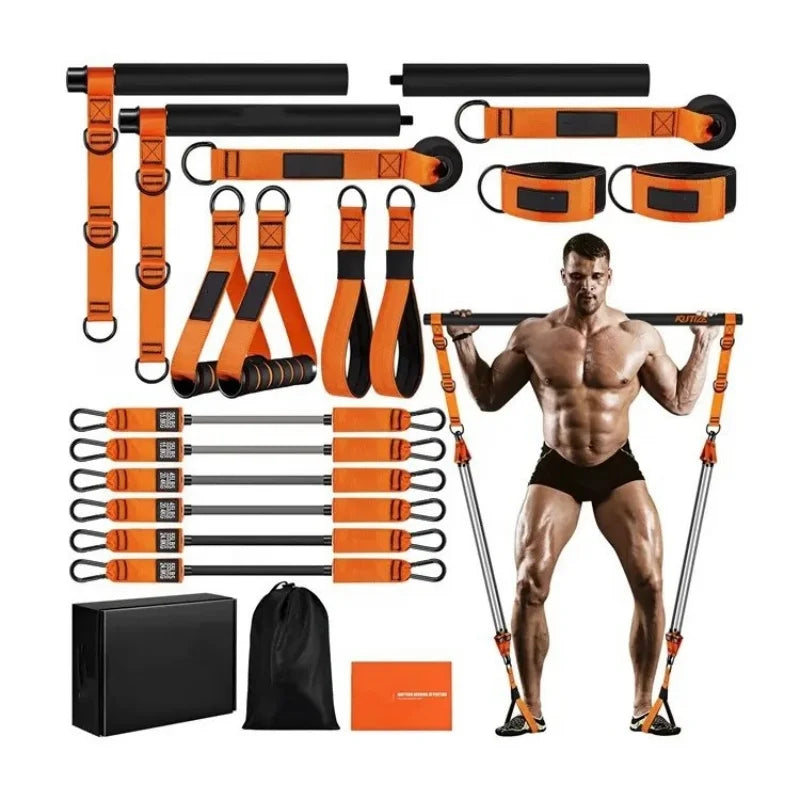 Pilates resistance bar and band home kit in black and orange, featuring handles, ankle straps, and a storage bag.