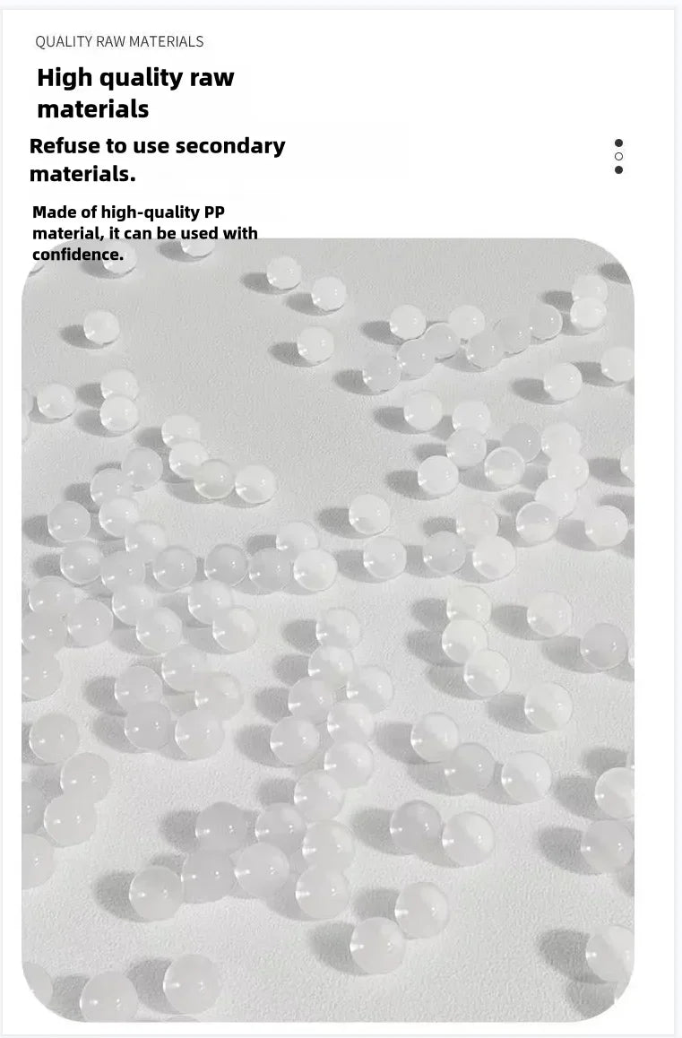 Small, translucent white plastic pellets scattered on a plain white surface, highlighting high-quality materials.