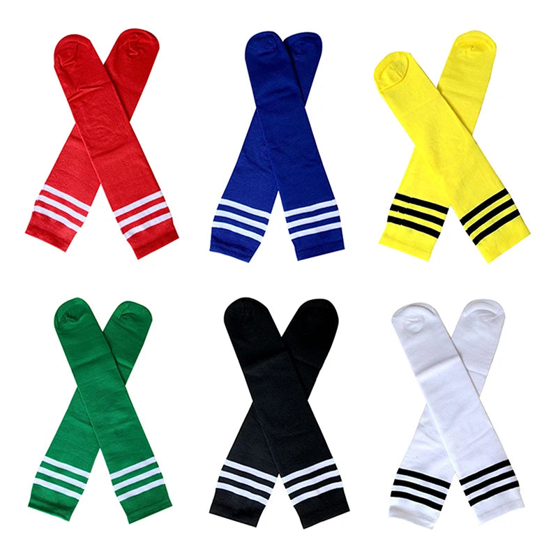 Six pairs of knee-high socks in red, blue, yellow, green, black, and white, each featuring three contrast stripes.
