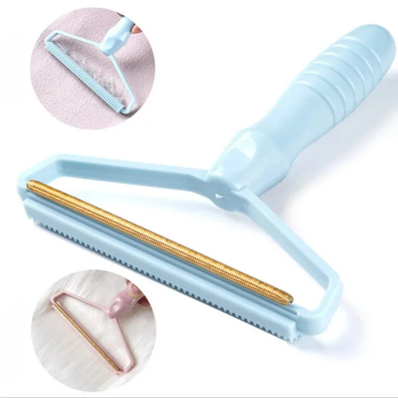 Light blue fabric lint remover with a gold-tone metal scraping edge and textured handle, showing in-use circles.