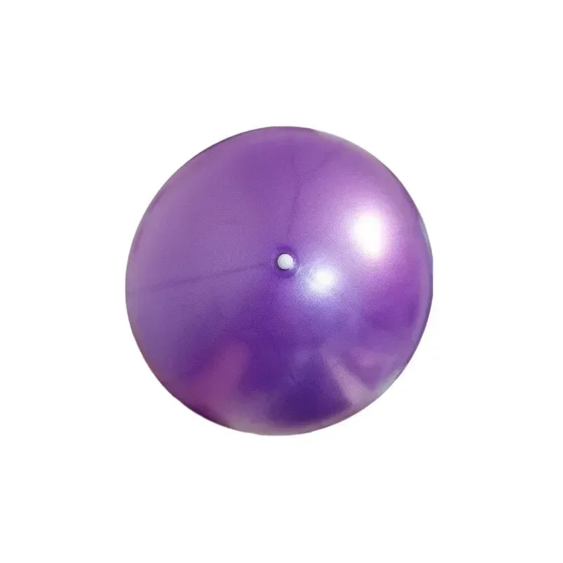 A shiny, bright purple inflatable gym ball with a small white inflation plug in the centre, on a white background.