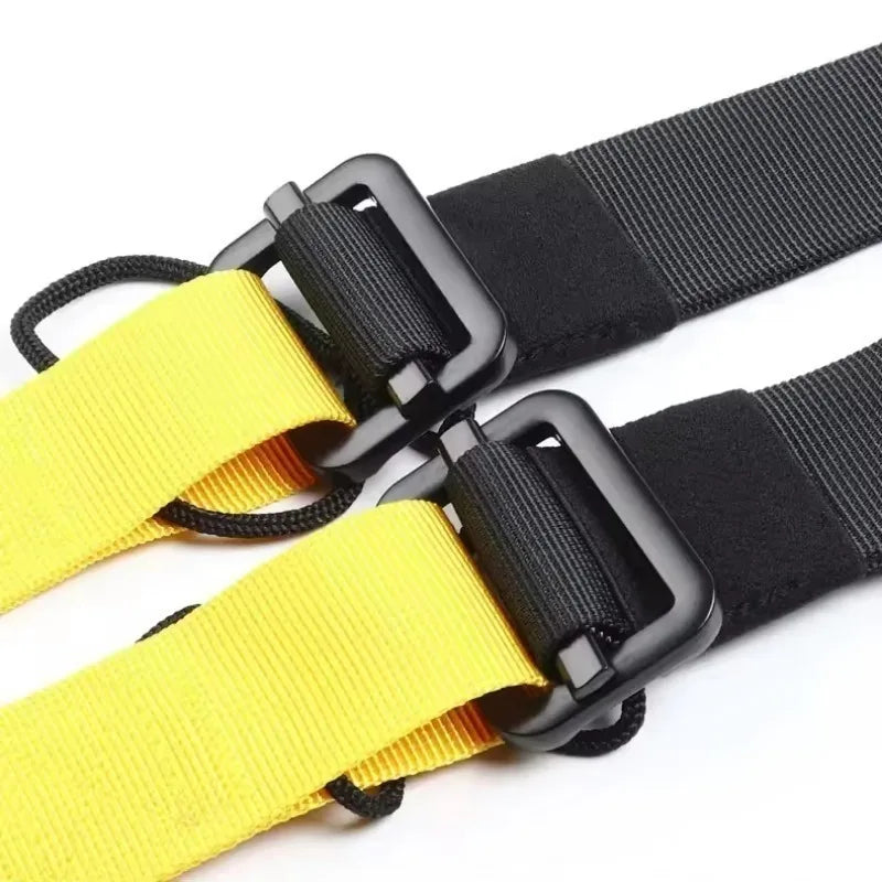 Black and yellow suspension training straps with heavy-duty black metal adjustment buckles.