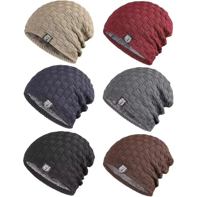 A selection of six unisex winter beanies in beige, red, navy, grey, black, and brown with a textured knit and plush lining.