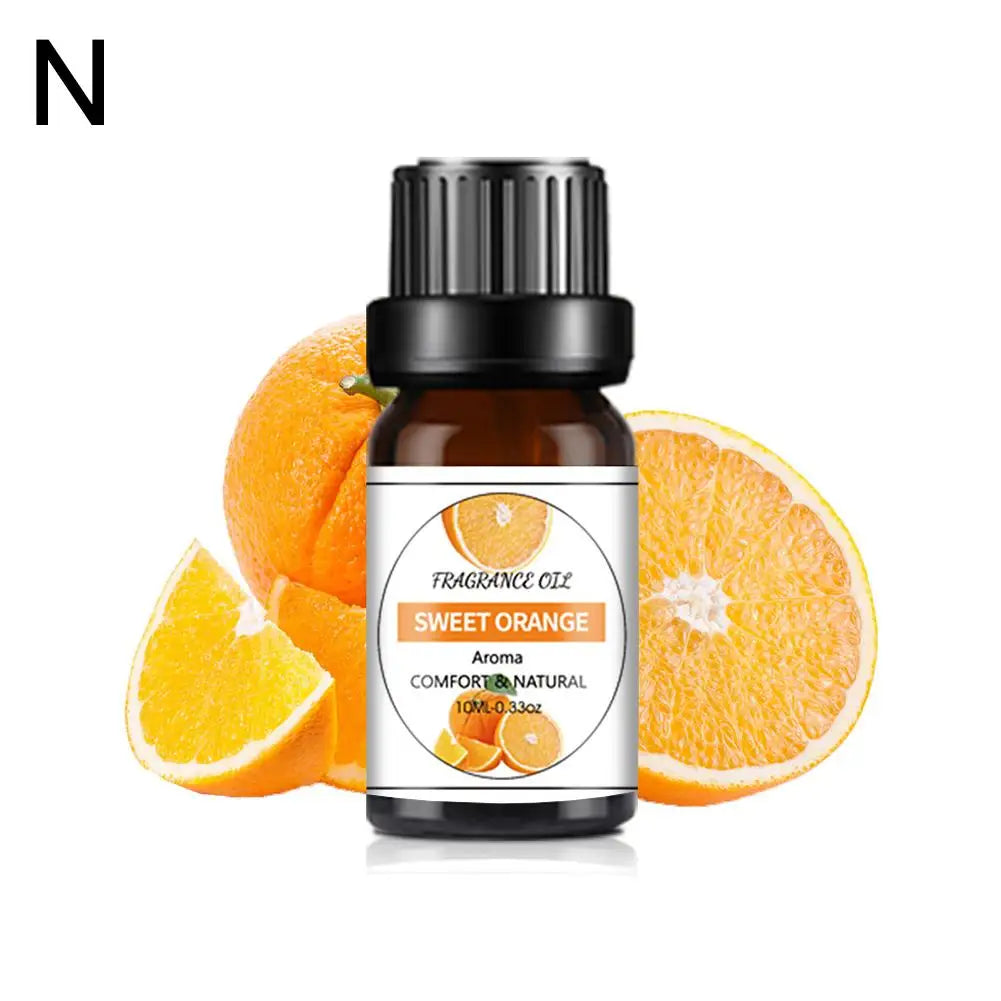 10ml bottle of sweet orange fragrance oil with a black cap, set against fresh orange slices.