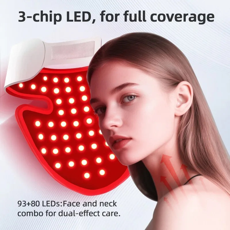 A woman with a red light therapy mask beside her face.