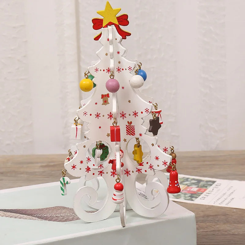 White decorative wooden Christmas tree ornament with colourful hanging baubles, presents and a yellow star topper.
