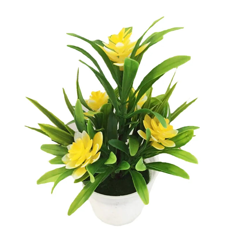 Artificial yellow flowers with green leaves in a small white pot, set against a plain white background.