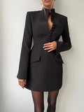 Black bodycon blazer dress with stand collar, single-breasted fabric buttons, and flap pockets.