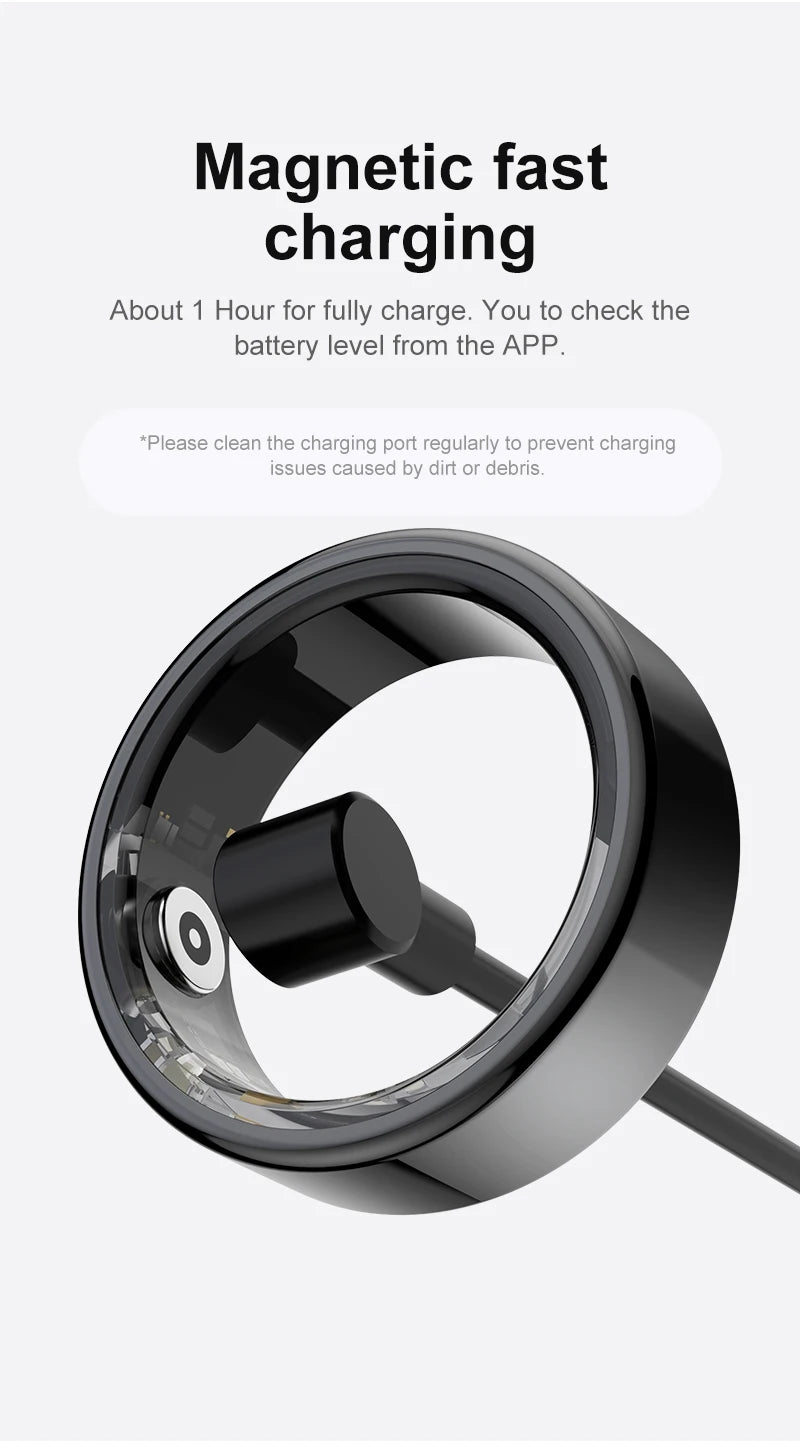 Sleek black smart health tracking ring being charged with a magnetic charging cable.