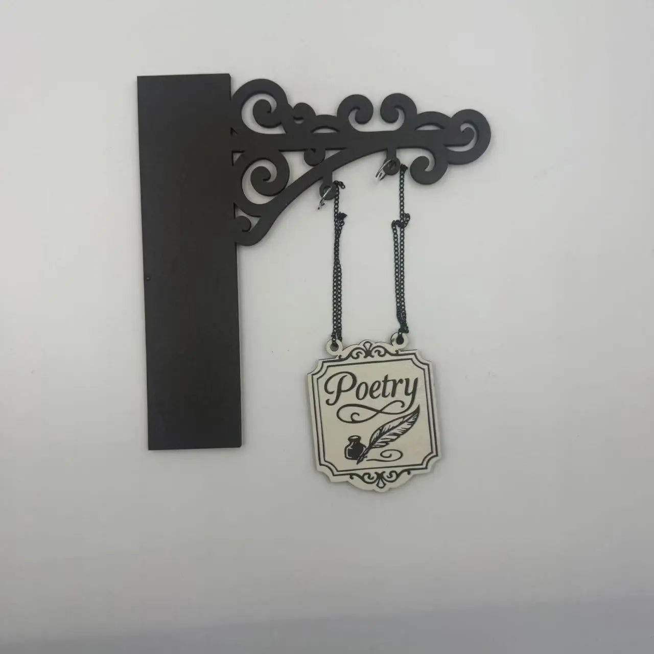 Black ornamental wall bracket with a hanging sign featuring a cream background, 'Poetry' text, and a quill and inkwell.