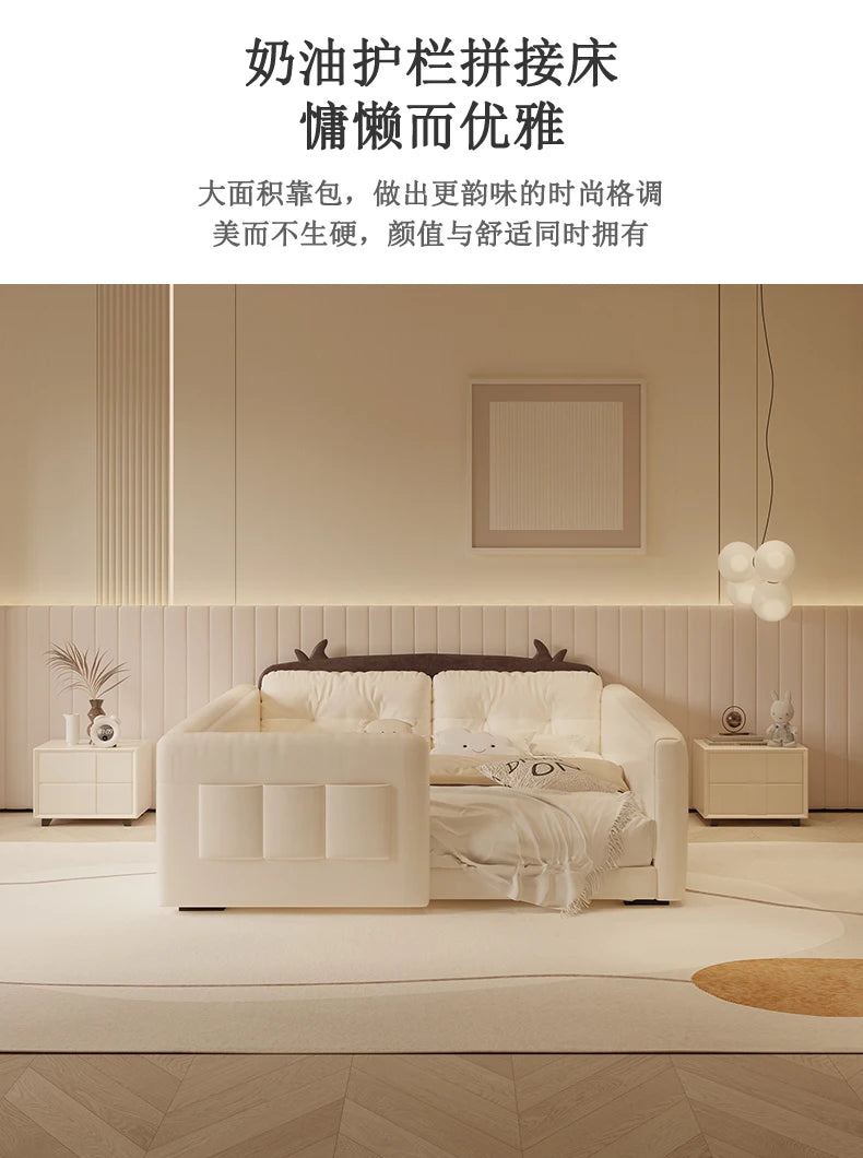 Cream-coloured upholstered parent-child bed with protective guardrails and whimsical cow-ear headboard detail.