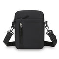 Minimalist black men’s crossbody bag with an adjustable strap, top zip closure and a vertical front zip pocket.