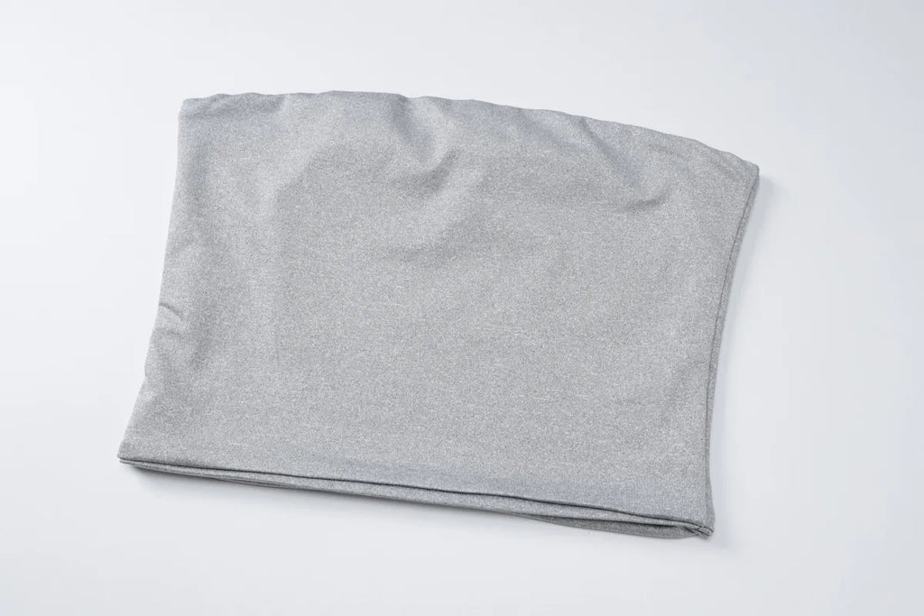 A folded, silver-grey strapless tube top in a smooth, stretchy fabric on a plain white background.
