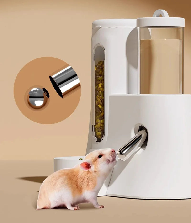 White pet feeder for small animals, featuring a clear food chamber, water dispenser, and a hamster sniffing the spout.