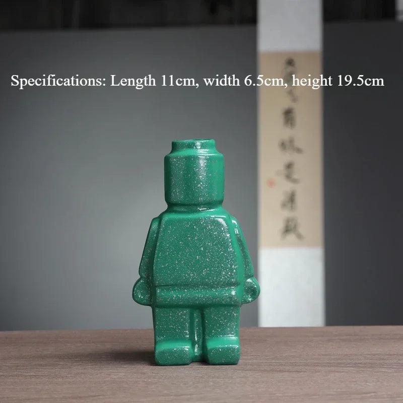 Green speckled ceramic vase shaped like a block-style human figure, 19.5cm tall. Quirky modern decor piece.