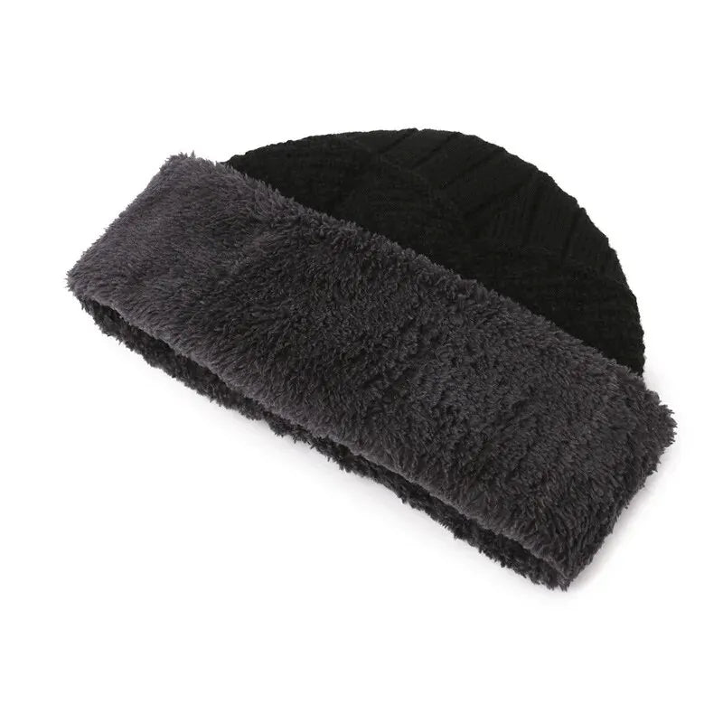 Black men’s winter knit hat with a thick, dark grey faux-fur lining and textured cable-knit pattern.