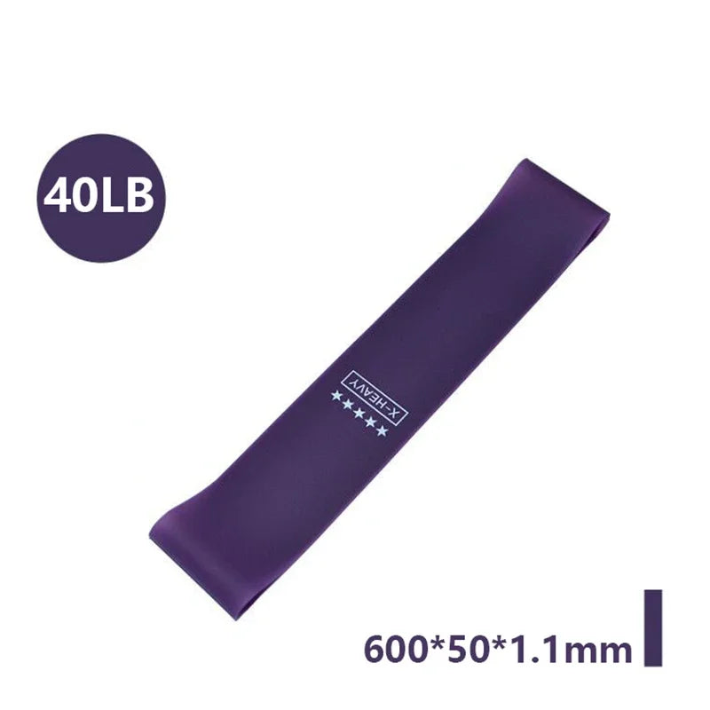 Purple X-Heavy resistance band with "40LB" label and 600x50x1.1mm dimensions printed on a white background.