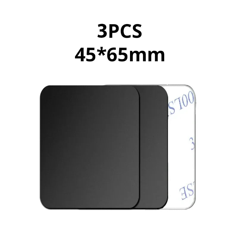 Three 45x65mm rectangular black adhesive pads with rounded corners on a white peel-off backing.