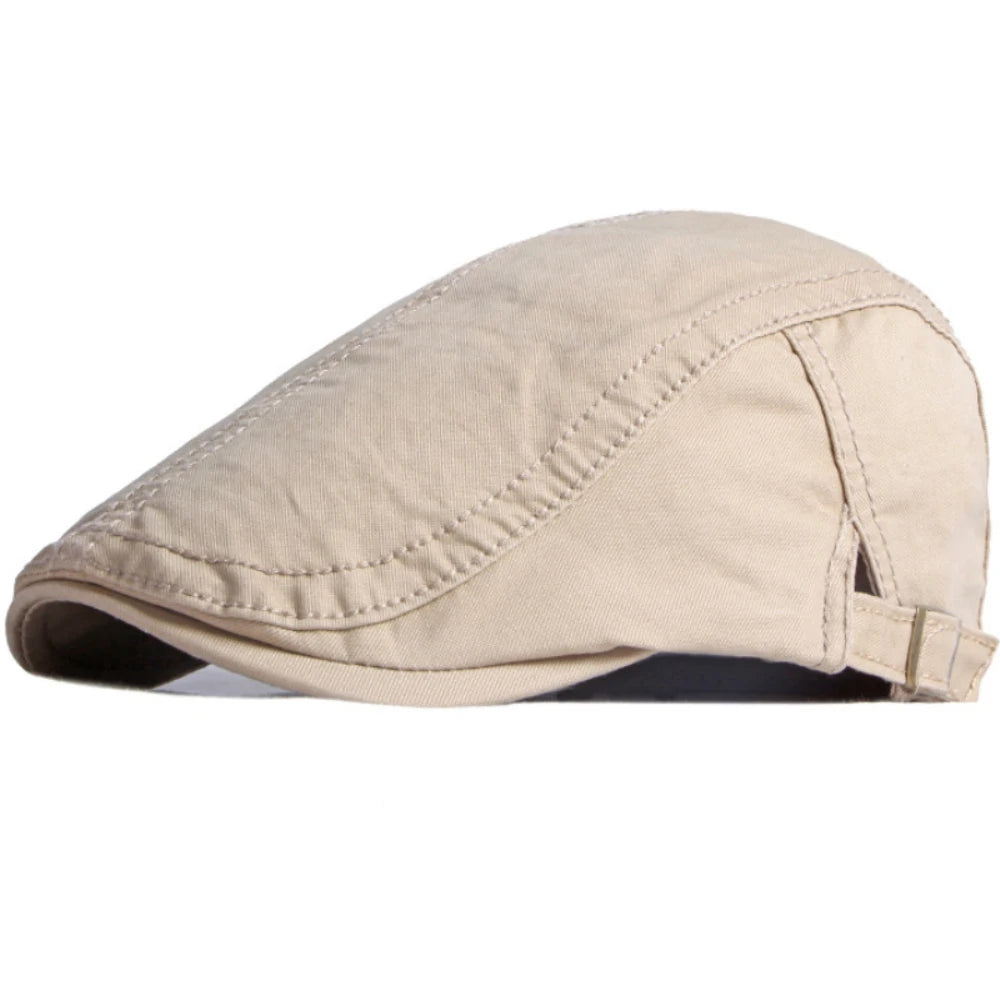 Beige cotton flat cap with stitched panel detailing and an adjustable side buckle strap.