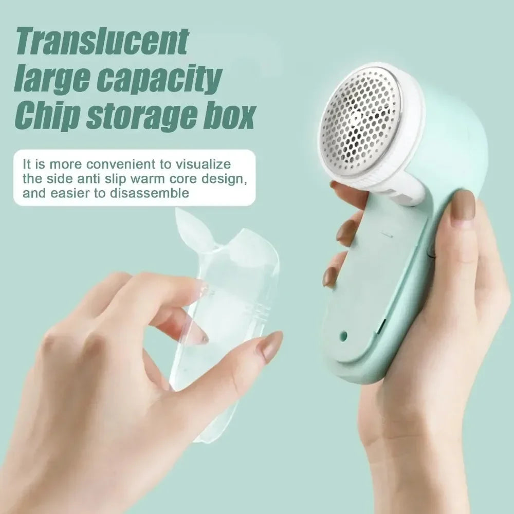 A hand holding a pastel mint fabric shaver with a detachable, translucent lint storage container.