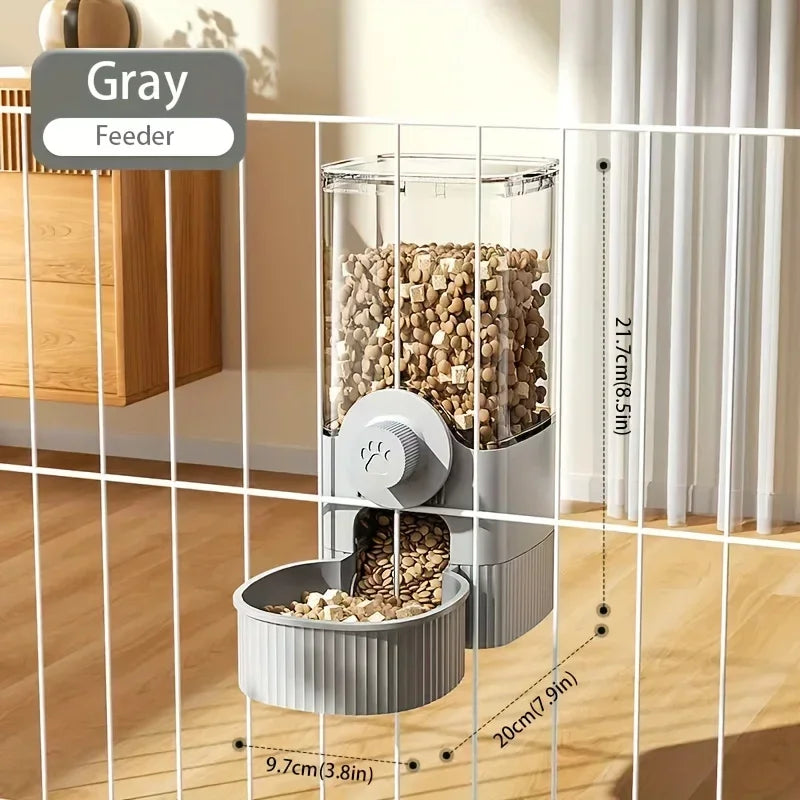 Gray wall-mounted pet feeder with a clear storage container and paw-print knob, attached to a wire crate.