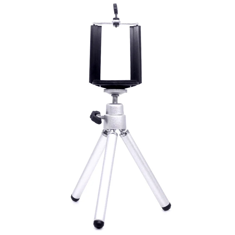 Silver tabletop tripod with an adjustable black smartphone mount for stable photography and video recording.