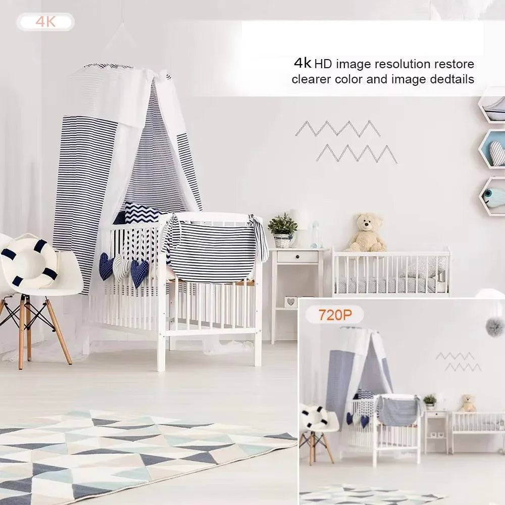 White wooden baby crib with a blue and white striped fabric canopy and matching heart-shaped bedding in a nursery.