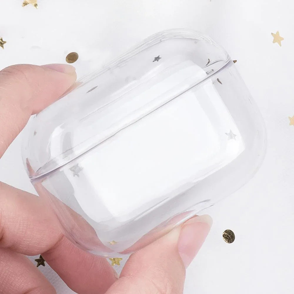 Clear transparent plastic case for AirPods Pro, featuring a subtle silver star pattern. Held in a hand.