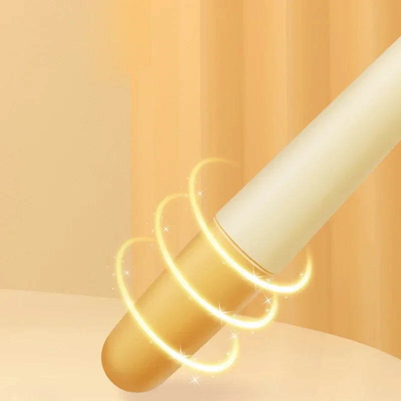 A cream-coloured makeup applicator or brush on a soft yellow background, surrounded by a glowing, sparkling light ring.