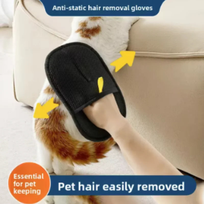 A person using a black, textured hair removal mitt to groom a ginger and white cat.