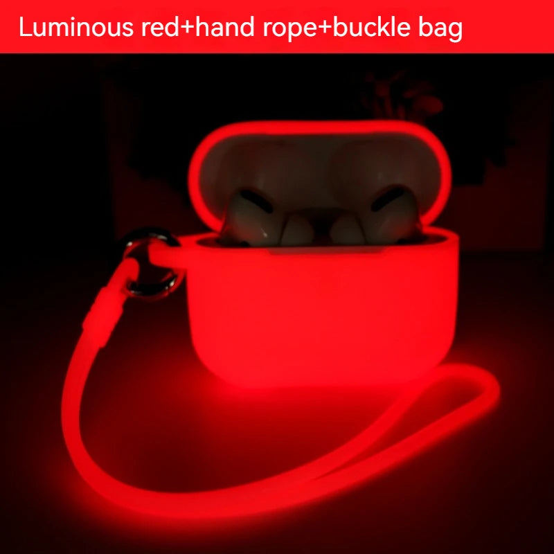 Luminous red silicone case for AirPods Pro with attached carry strap and metal buckle, glowing in the dark.