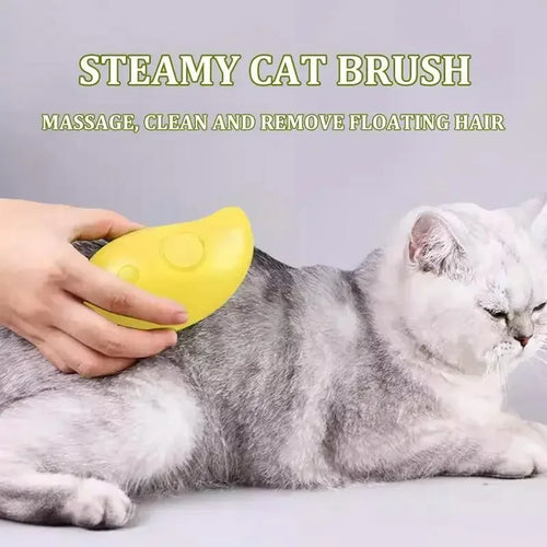 A person using a yellow, mango-shaped electric steamy brush to groom a grey and white cat.