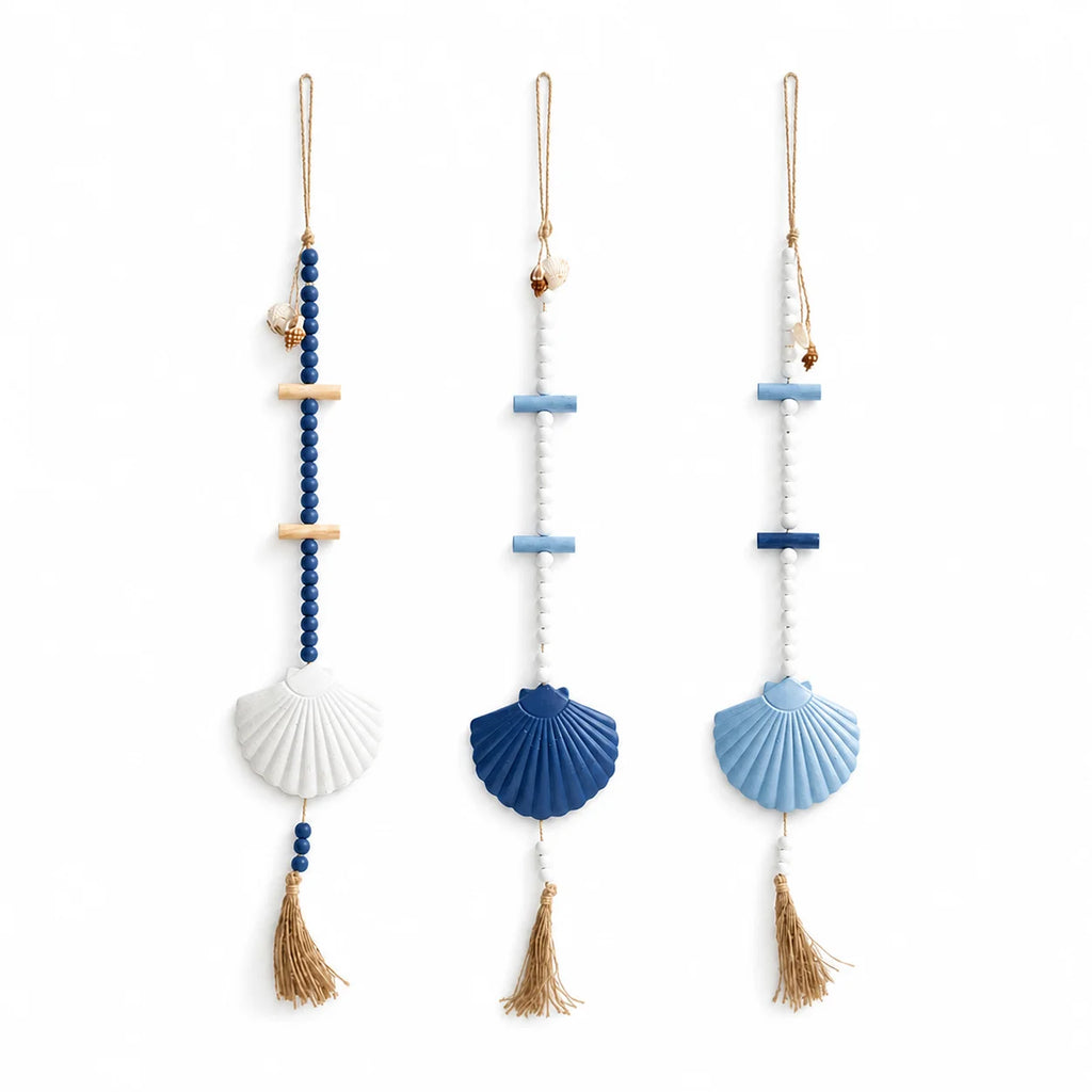 Set of three boho wall hangings featuring blue and white beads, wooden accents, seashell charms, and jute tassels.