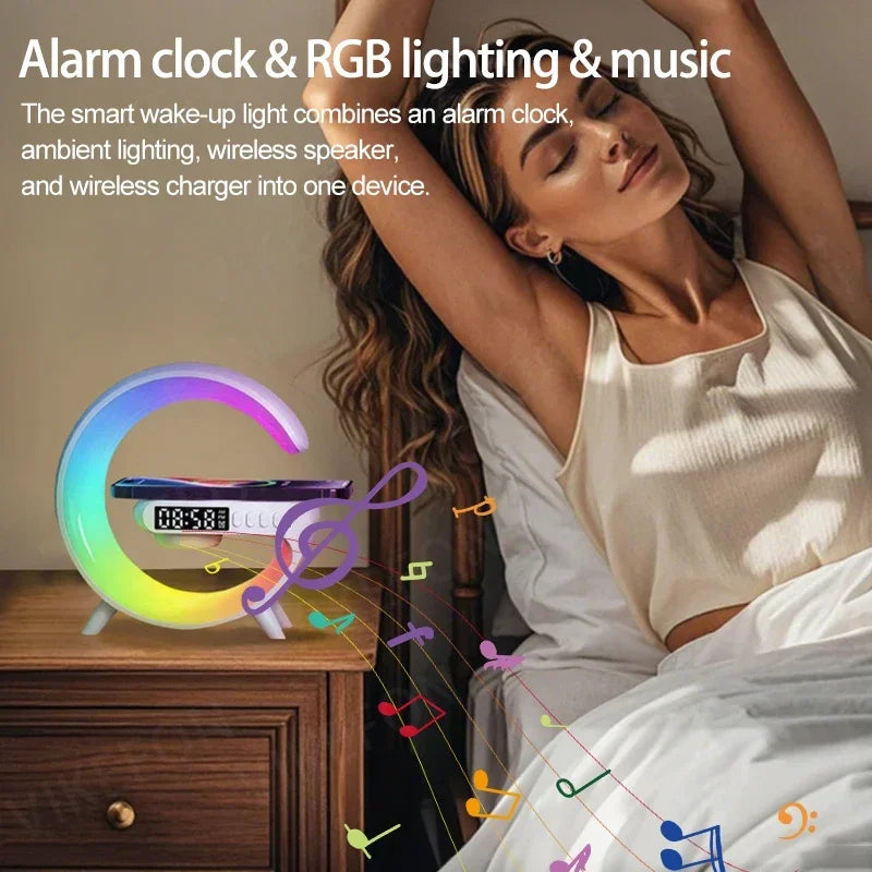 Circular white bedside speaker with multicoloured RGB lighting, digital clock, and wireless phone charging dock.