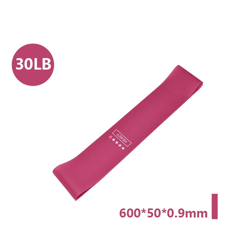 Heavy-duty pink resistance band featuring a 30LB label and dimensions of 600x50x0.9mm.
