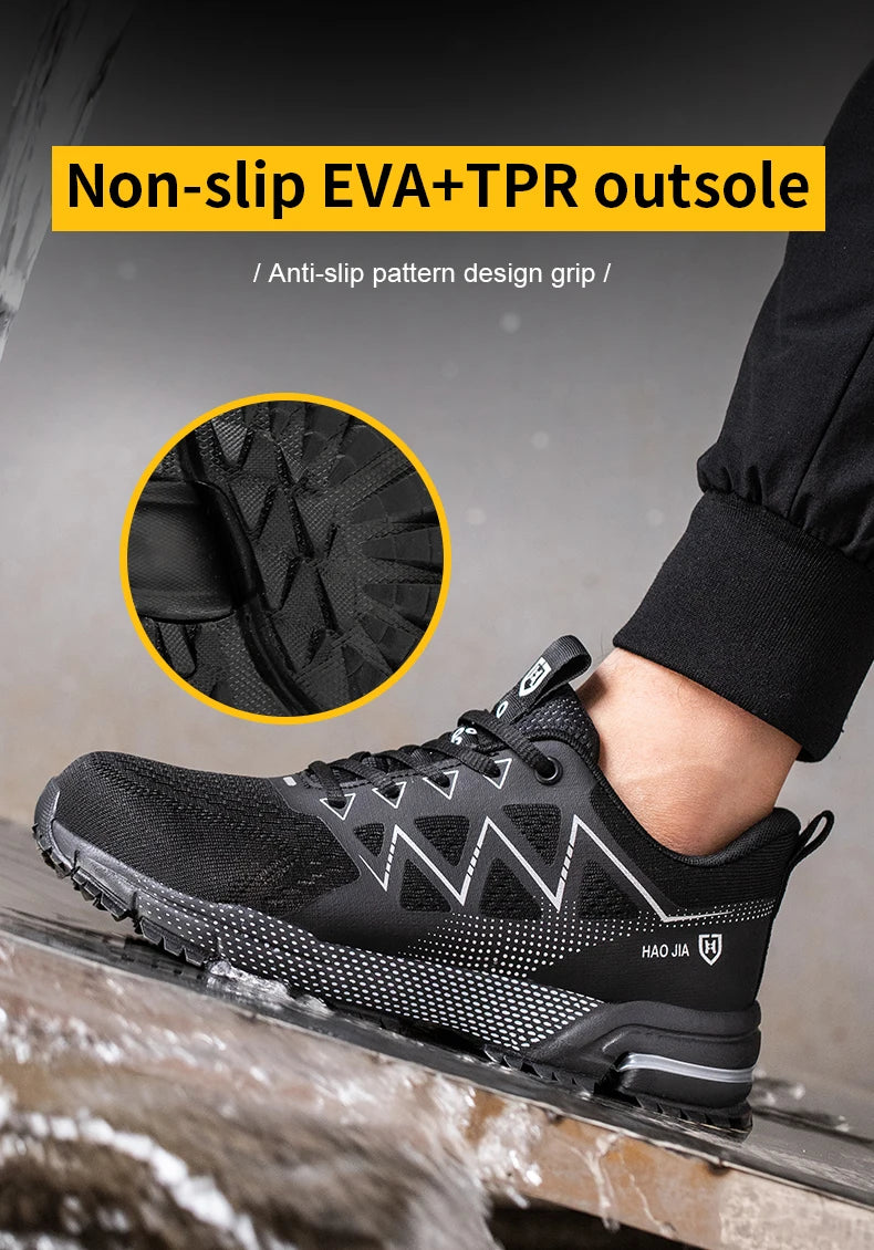 Black safety work sneaker with steel toe, breathable mesh, and a textured non-slip outsole.